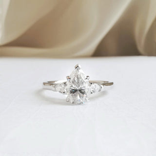 1-50-ct-pear-shaped-moissanite-three-stone-engagement-ring