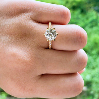 round-cut-solitaire-pave-moissanite-engagement-ring